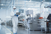 GettyImages-1462154865 Scientist Using Laptop In Manufacturing Facility
