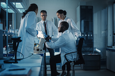 Laboratory scientist ipad GettyImages-1293773576