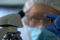 GettyImages-1081762792-research-blood-sample-microscope