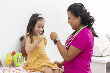 Pediatric doctor and little girl-GettyImages-1406827165