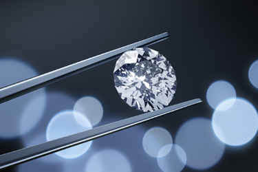 Large Diamond with Tweezers=iStock-1252617238