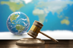 earth globe judge gavel-GettyImages-984611700
