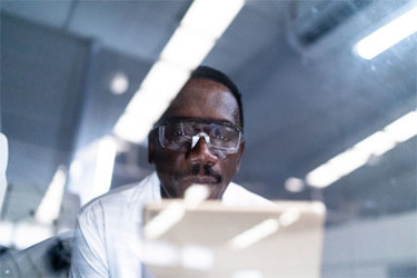 Scientist Using Tablet GettyImages-1325056425 Scientist Using Tablet GettyImages-1325056425