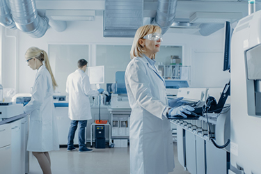 Scientist laboratory blood and genetic samples iStock-1140779754