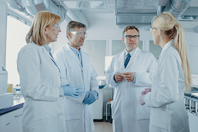 Scientist lab discussion meeting GettyImages-1140779742