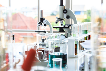 GettyImages-1133603364-lab-equipment-microscope-beaker-test tube