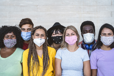 Group of young peope wearing masks iStock-1263008144