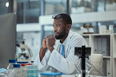 Scientist Laboratory thinking GettyImages-1370154318