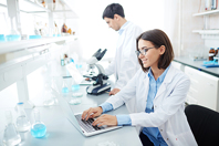 scientist lab research data laptop iStock-589973864