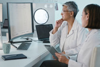 GettyImages-1483243079-doctors-data-computer-analysis-tablet-office