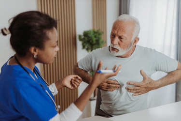 Senior man visiting doctor-GettyImages-1345850243