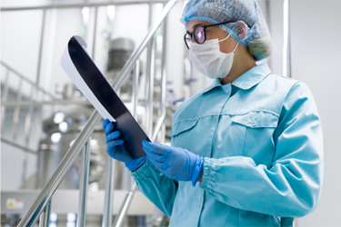 GettyImages-637368252 Scientist Monitoring Equipment Readings, CQV Concept