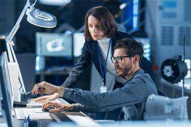 GettyImages-1214111358 Team Of Professionals Working Together On Computer