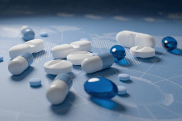 GettyImages-1832921718-pills-medicine-blue-background