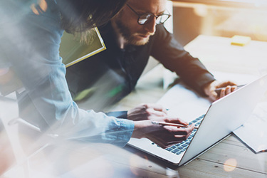 teamwork laptop iStock-517497078.jpg