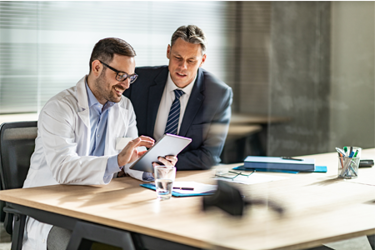 GettyImages-1204781345 doctor tablet meeting GettyImages-1204781345 doctor tablet meeting