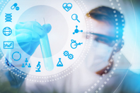 Biotech scientist looking at test tube