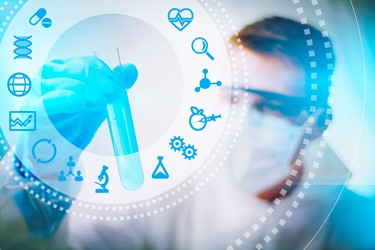 Biotech scientist looking at test tube