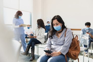 Adult woman sits in waiting room-GettyImages-1372189785 Adult woman sits in waiting room-GettyImages-1372189785