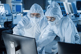 Cleanroom Scientists At Computer GettyImages-1294339594