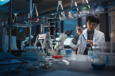 GettyImages-1293773578 Scientist Using Pipette In Medical Development Lab